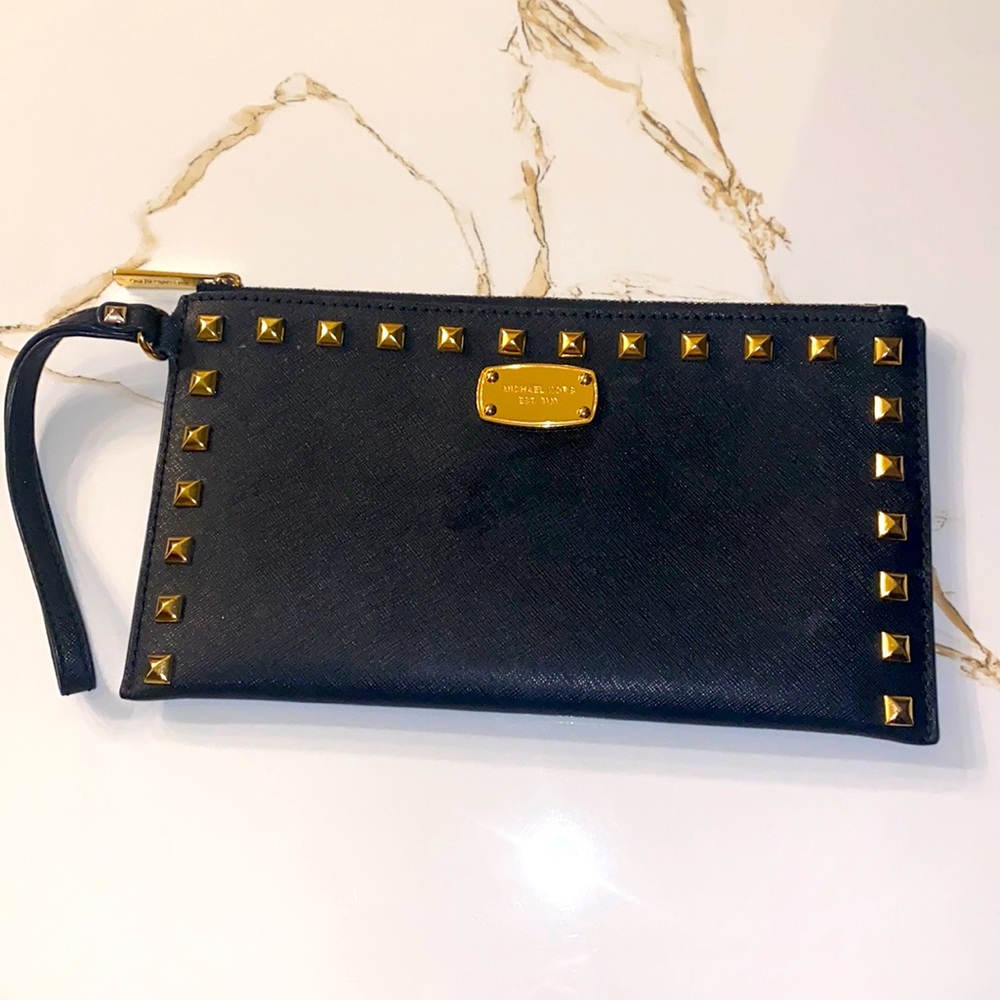 Michael Kors black and gold wristlet.